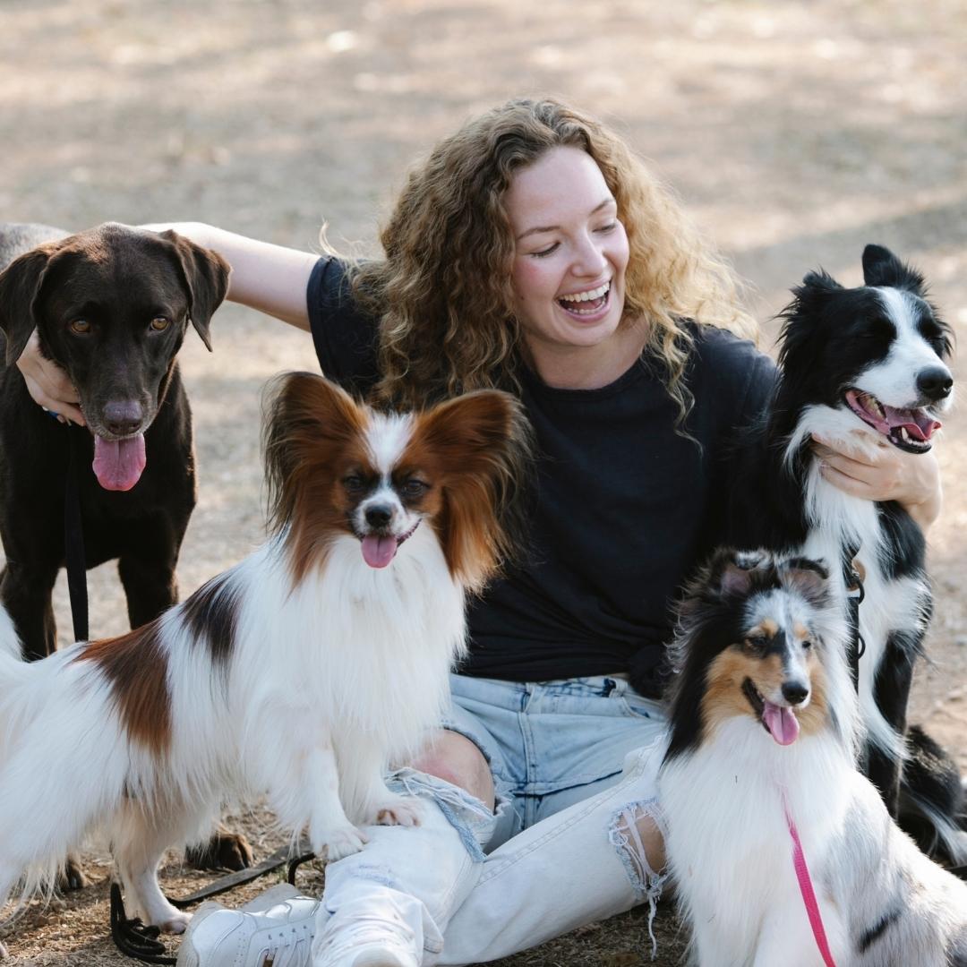 Woman playing with puppies